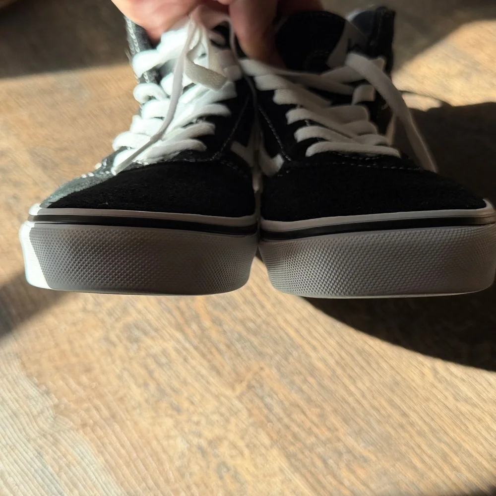 Vans Off The Wall Black and White High-Top Skate Sneakers